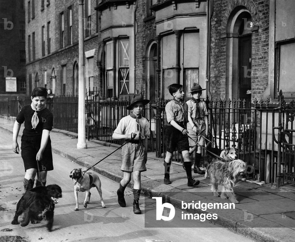 Scouts of the 68 Hackney Troop do their daily good - turn by taking war-workers dogs out-for exercise. The boys are trusted with the keys of the houses and quickly become pals with their charges who await their call. April 1942