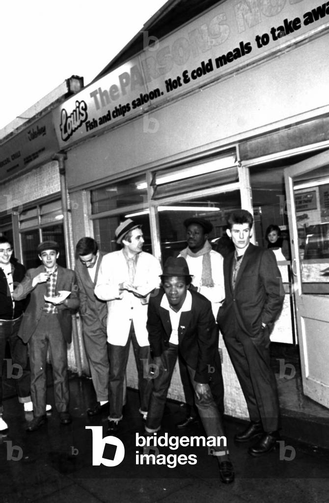 The Specials pop group in chip shop called 'The Parson's Nose' in Bishop Street, Coventry.