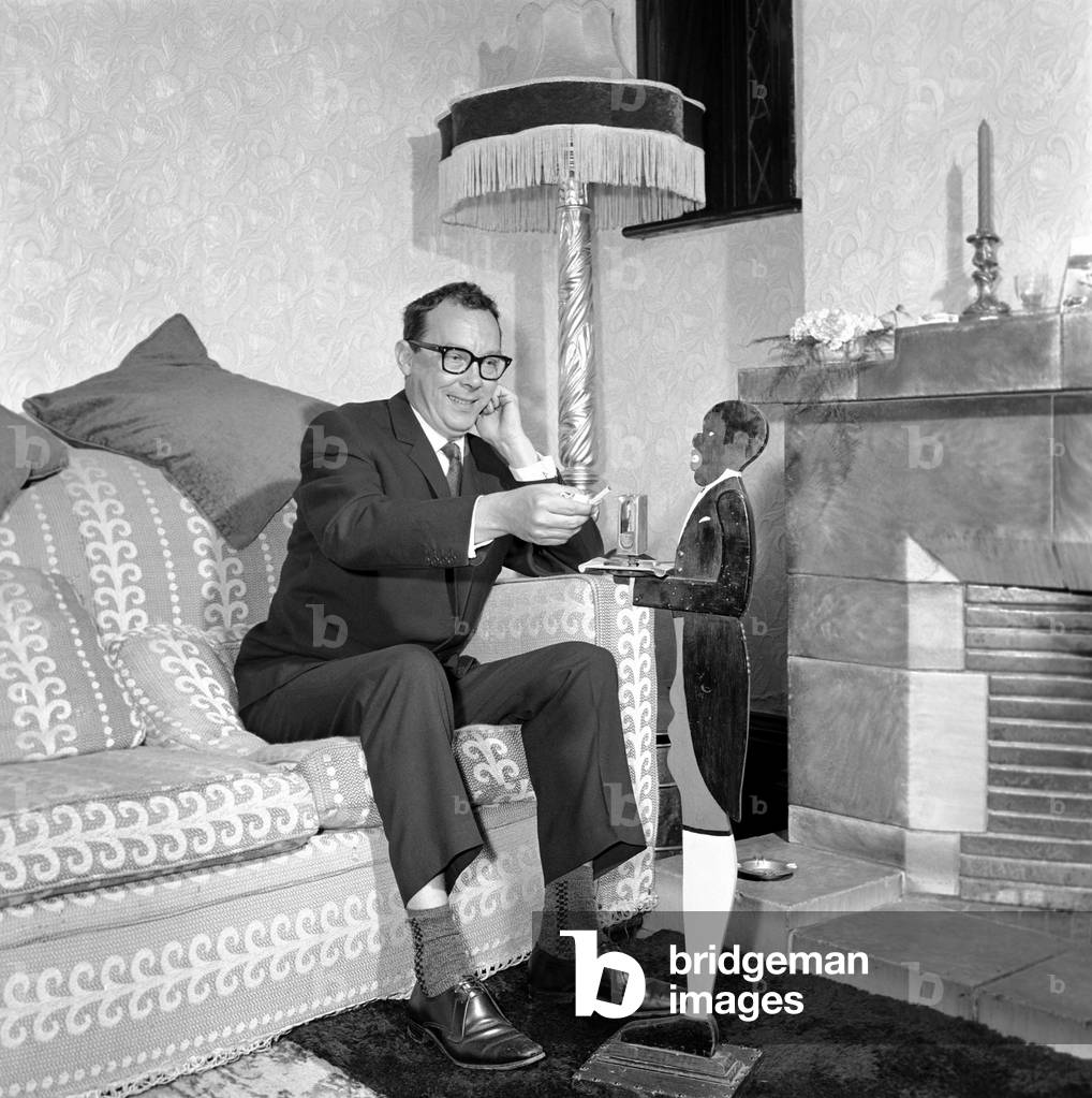Eric Morecambe seen here at home, 1963 (b/w photo)