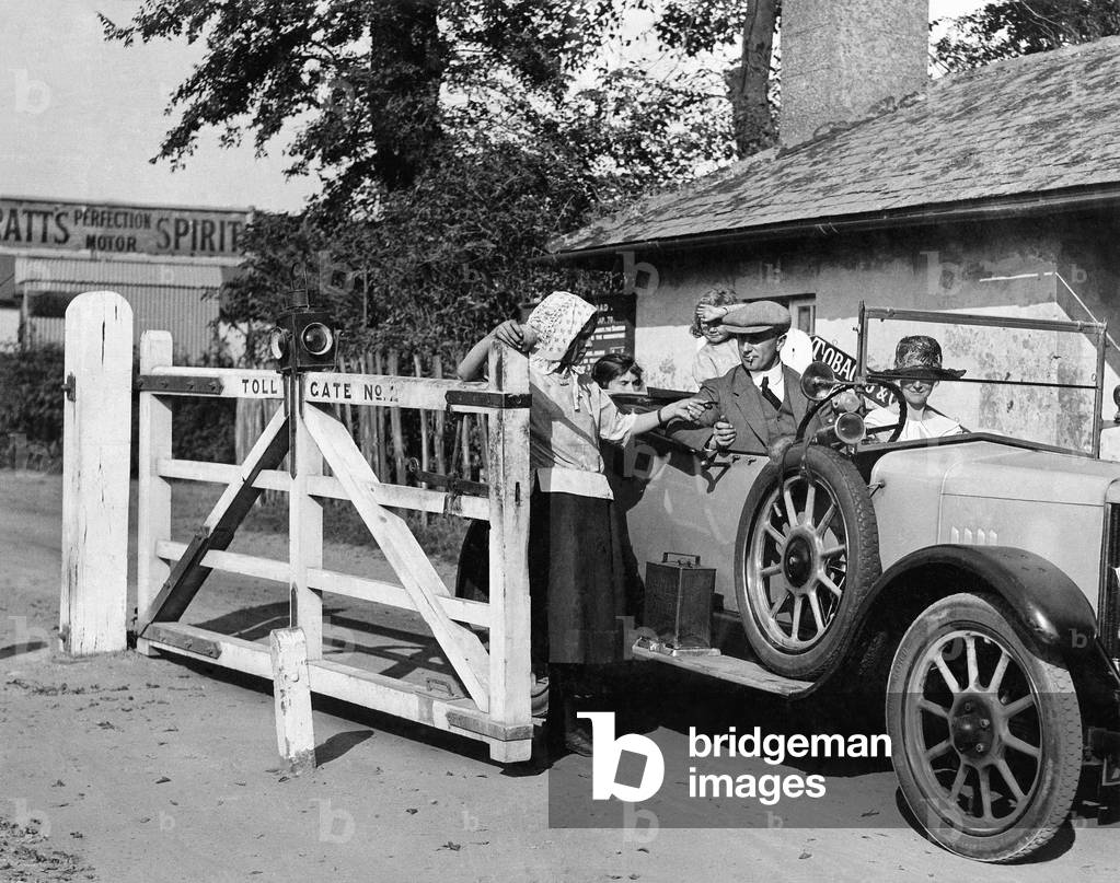 Rye's famous toll abolished. Well known to thousands of motorists in Sussex, the picturesque toll road, connecting the historic points of Rye and Winchelsea, has been abolished. 29th August 1927 (b/w photo)