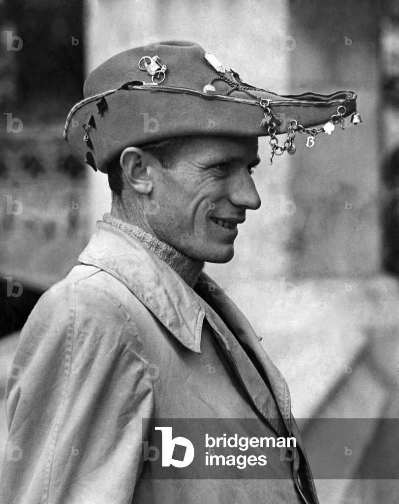 Clothing: Fashion Men Wear Hats: This is what the well-dressed University student must wear in Turin, Italy, and this is Rosso Giovanni, 23, wearing it London yesterday. It's the same as a cap and gown at Oxford (well, almost). It means that Rosso is a student of economics. September 1948 (b/w photo)