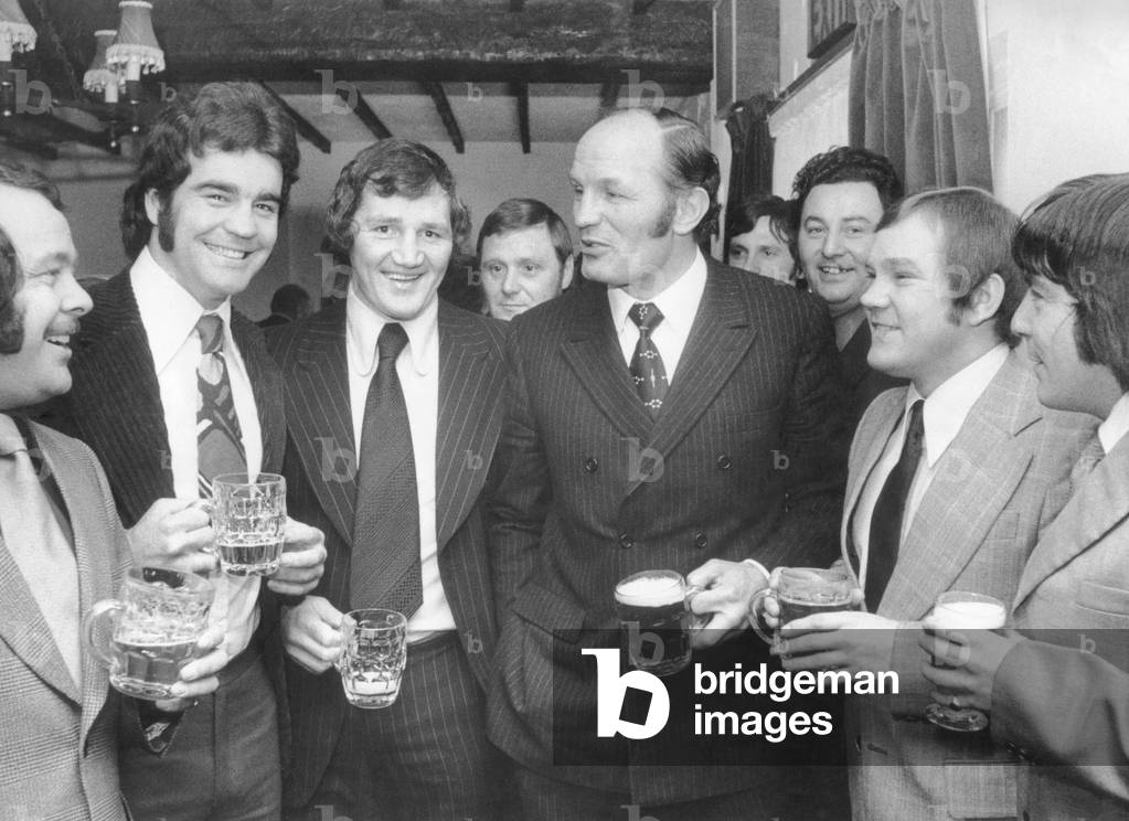 Former British Heavyweight champion boxer Henry Cooper at the Ryton Bridge Hotel, Ryton, Coventry, for the opening of a new extension. He is pictured with former Coventry boxers Tommy Cox, ex-amateur heavyweight (left), Frank Carpenter, former A.B.A heavyweight finalist (2nd left), and Tony Riley, who fought for the British lightweight title (right). 27th February 1974 (b/w photo)