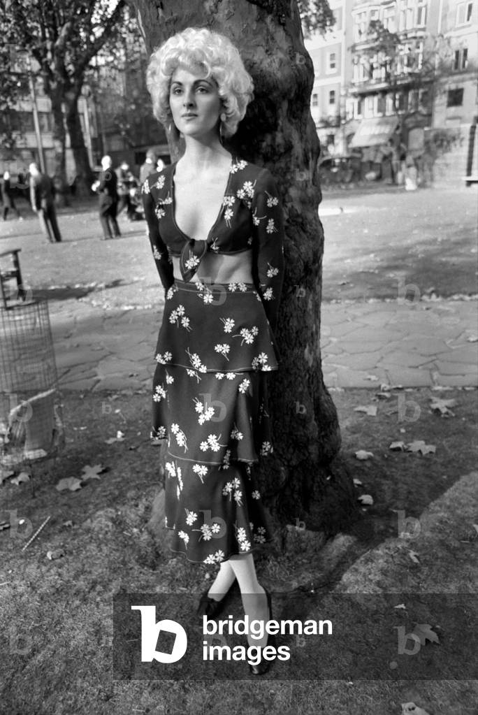 The Clothing Export Council of Great Britain announce the opening of London Fashion week Export Shows at Celanese House. Wendy Harman wearing a printed dress by Tony Berkeley, October 1969 (b/w photo)