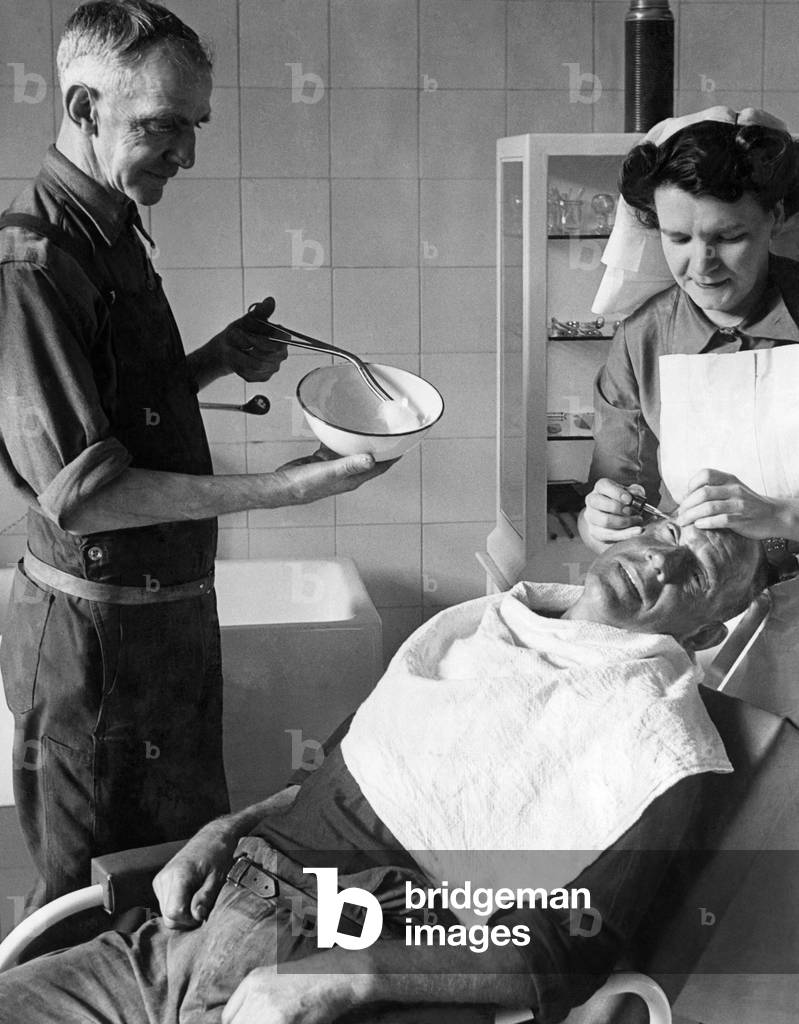 Another pithead medical centre has been opened at Coegnant Colliery in the Llanfi Valley. Nurse checking up on a miner