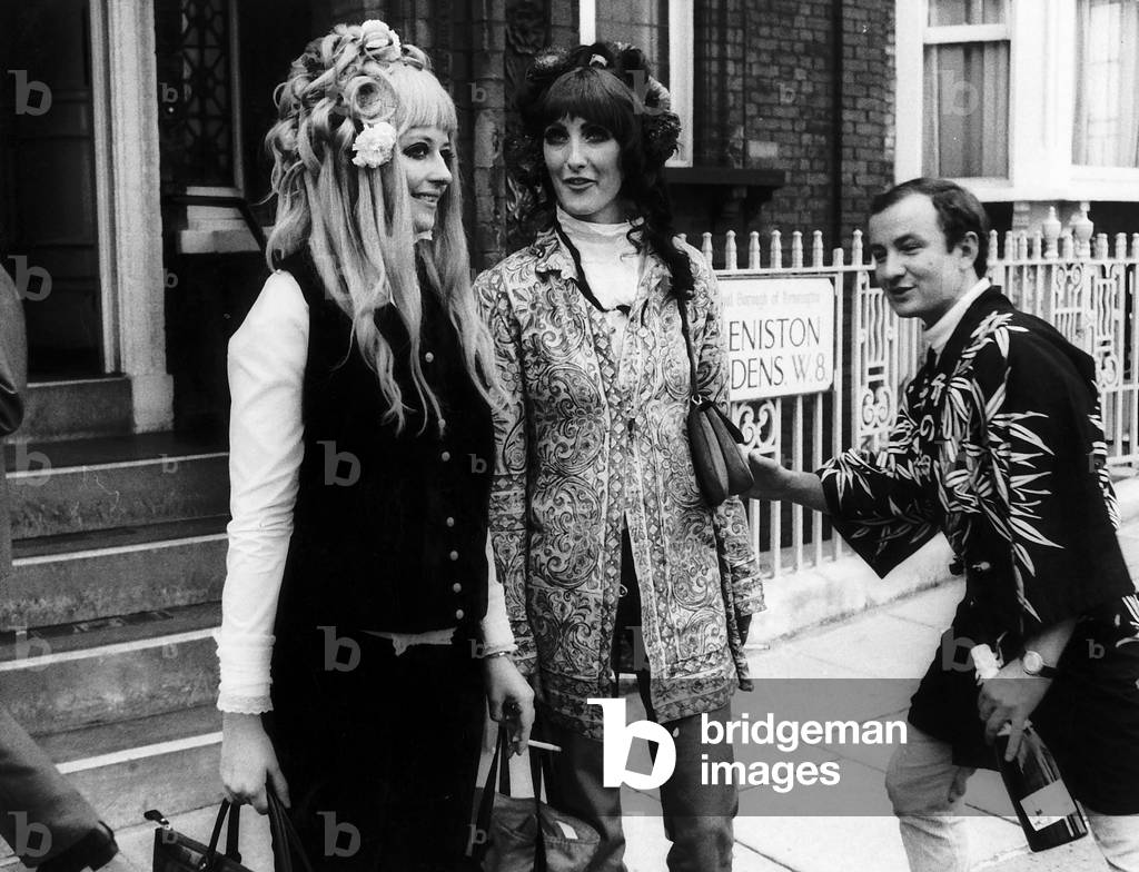 Hippy wedding guests and best man (b/w photo)
