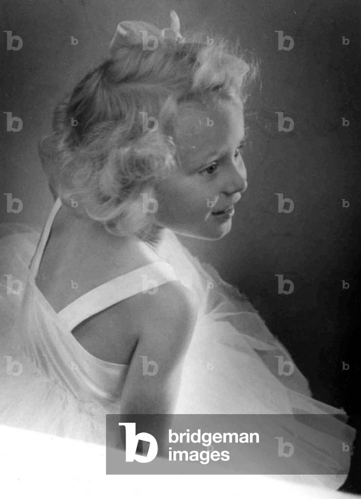 Young girl wearing a white dress
Circa 1945