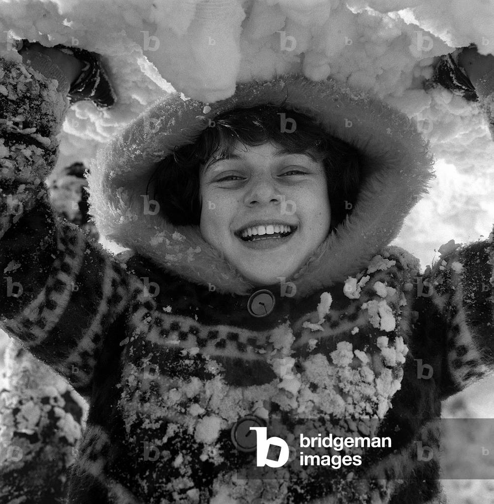 Children playing in the snow on Hampstead Heath on New Years Day, 1962 (b/w photo)
