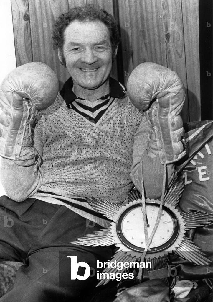 Mick Leahy, legendary boxer from Tile Hill, Coventry, surrounded by souvenirs of his boxing career.
15th December 1982