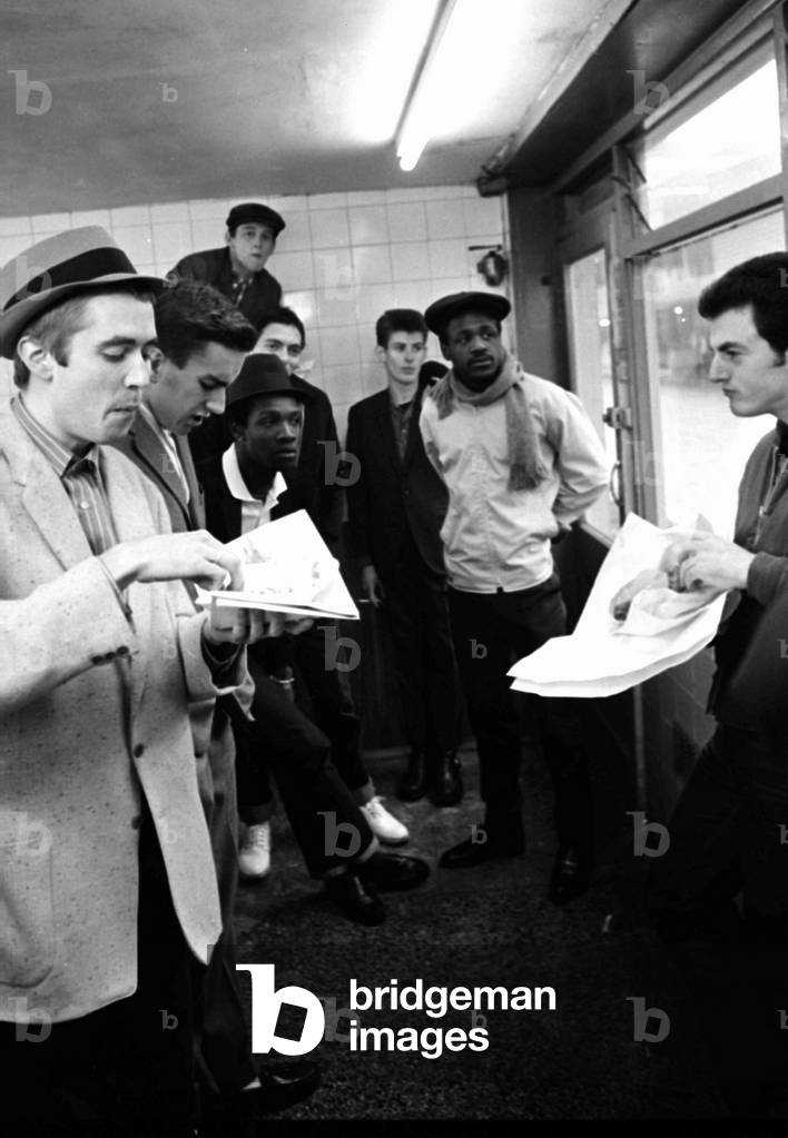 The Specials pop group in chip shop called 'The Parson's Nose' in Bishop Street, Coventry.