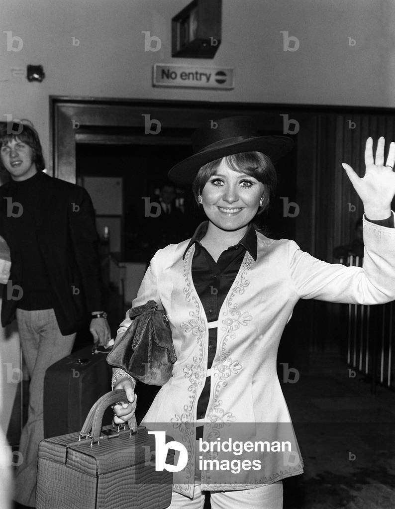 Lulu arriving at Heathrow Airport, March 1969, winner of the UK Eurovision Song Contest in Madrid (b/w photo)