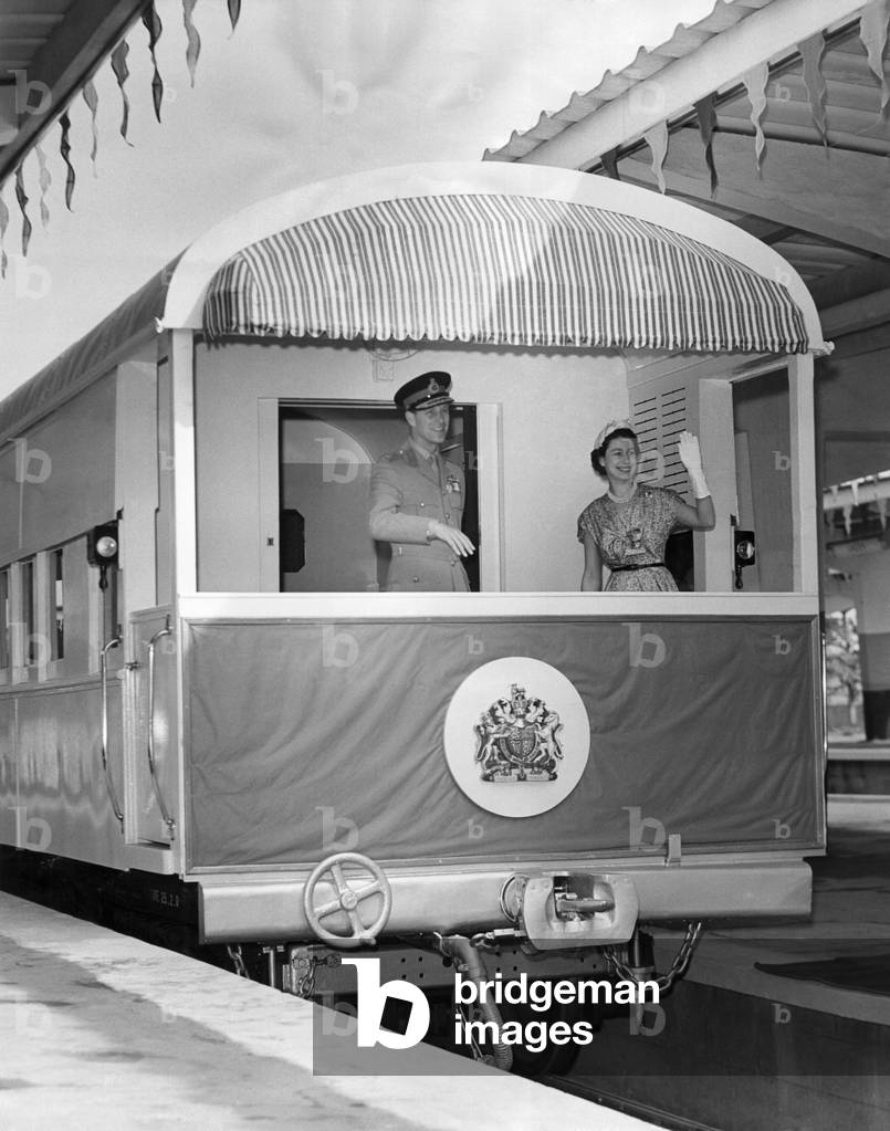 Queen Elizabeth II and Duke of Edinburgh: Royal tour of Nigeria 1956: A charming and unusual picture of the Queen and the Duke as the Royal train left Lagos Terminus on Saturday 11th Feb, en route for Ibadan. February 1956 (b/w photo)