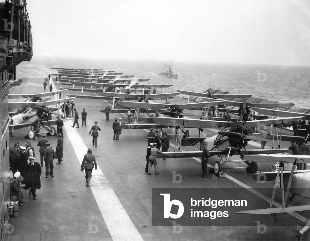 The Flight Deck of the Royal navy aircraft carrier HMS Courageous showing the planes lined up on deck.
 June 1921