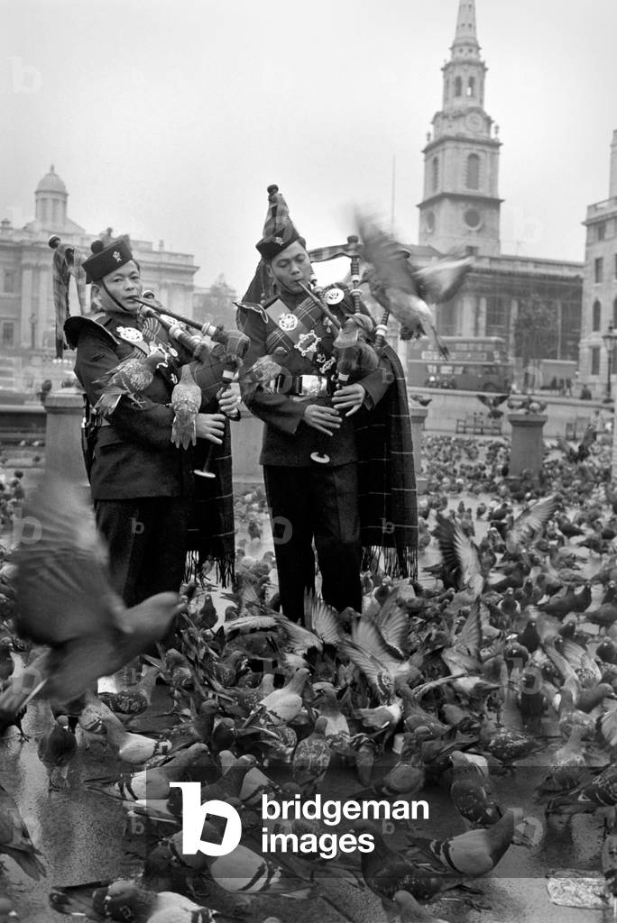 Military Army: The 7th Duke of Edinburgh's Own Gurkha Rifles, many whom have seen action in Borneo, are visiting England especially to take part in the Lord Mayor's show on Saturday (No. 8) These 35 Gurkhas, who have come from Hong Kong, were playing their pipes and drums on the steps of St. Pauls Cathedral, dress in their colourful rifle green dress uniforms. November 1969
