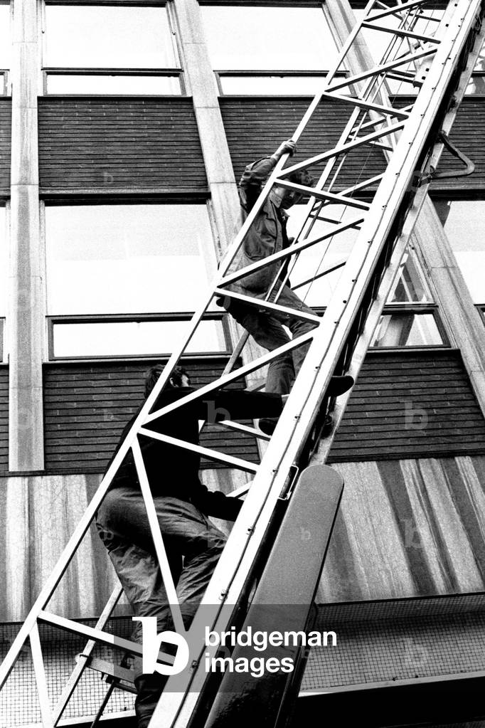 Window cleaners Richard Pendleton and John McKenzie were trapped for 20 minutes after their cradle broke down on the Gallowgate side of the Scottish and Newcastle Breweries building, 21st April 1970 (b/w photo)