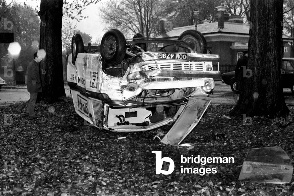 A group 4 security van upside down after the accident. November 1969