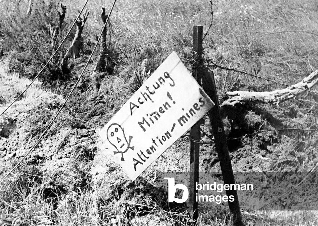Warning of German minefield found by Canadian soldiers on arrival in France. WW2, 17/08/1944 (b/w photo)