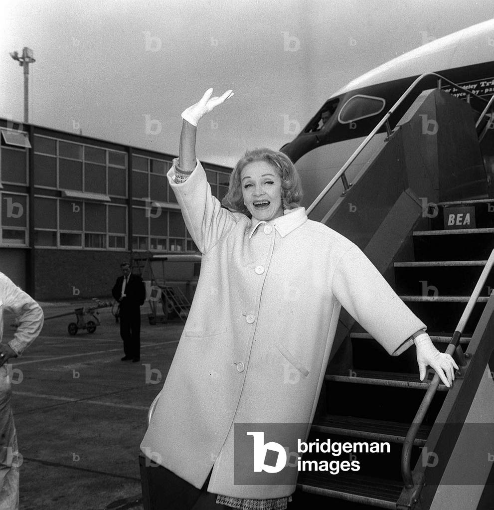 Marlene Dietrich arrives at London Airport, 1965 (b/w photo)