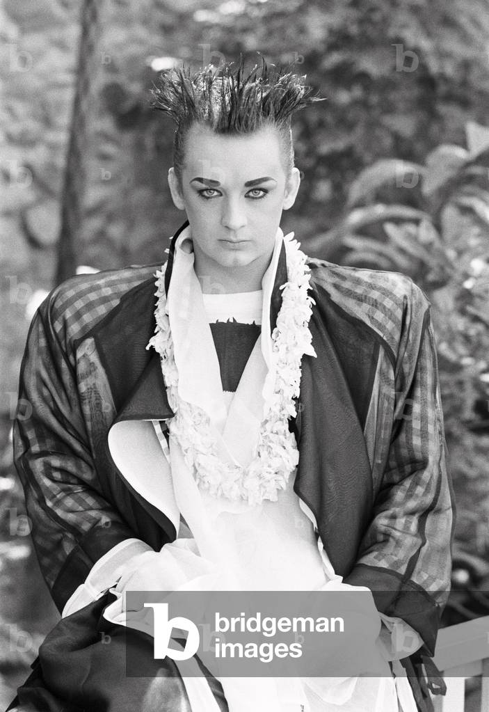 Culture Club singer Boy George poses outdoors in the garden, August 1985.