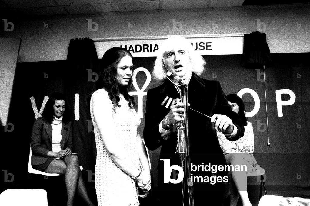 Jimmy Savile was greeted with screams when he arrived to open the new restaurant at Winthrop Laboratories on July 28, 1971 He also crowned Irene, aged 23, as the new Miss Winthrop 1971