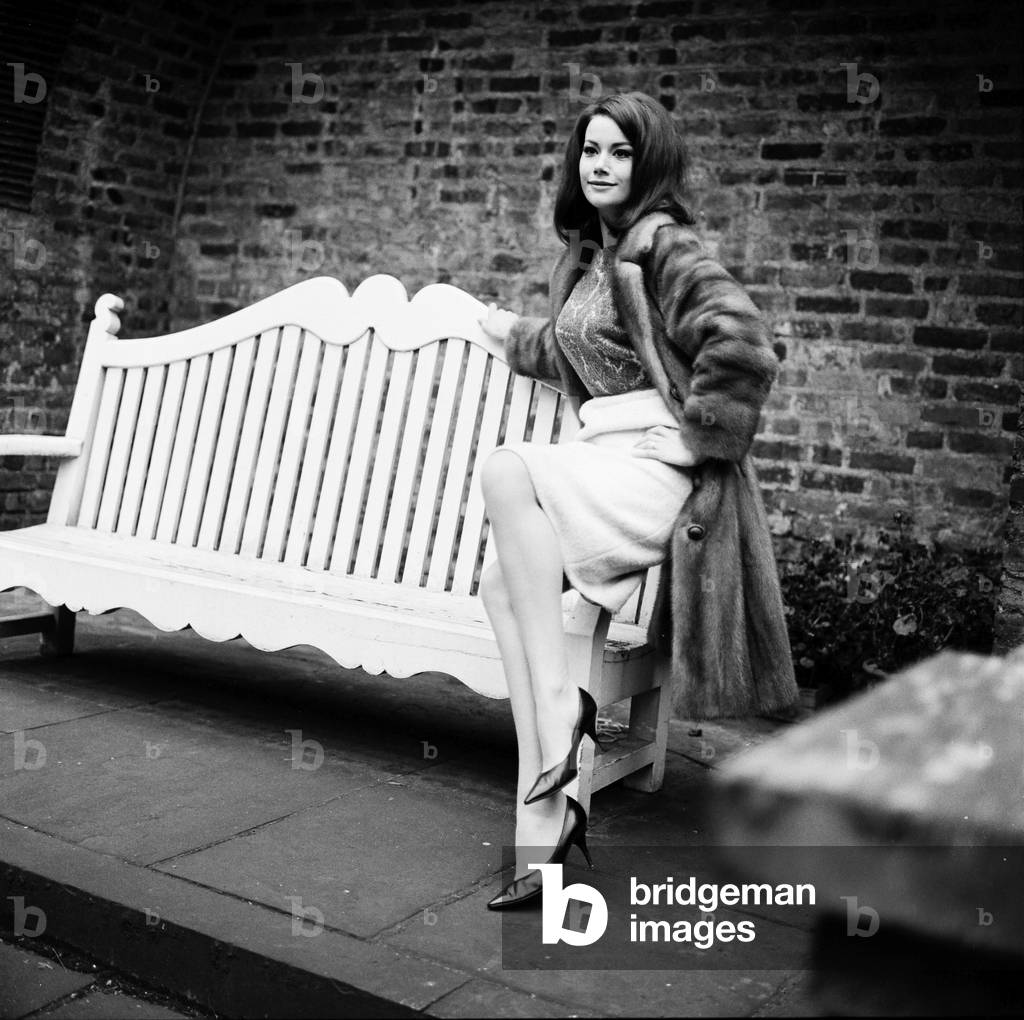 Parisienne actress Claudine Auger who will play Domino in the James Bond film Thunderball, seen here during an interview with the Daily Mirror show business reporter Donald Zec. 17th February 1965 (b/w photo)