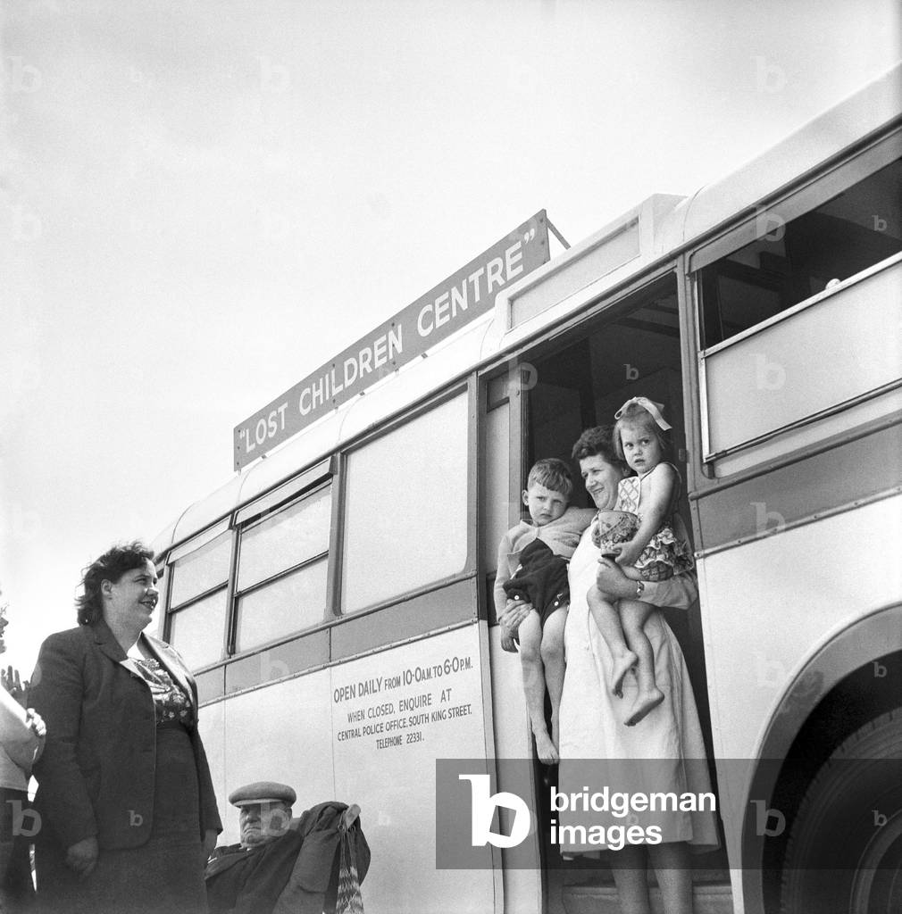 Blackpool beach, lost children at the Missing children caravan on the beach at Blackpool waiting to be claimed by their mums and dads. Lancashire, June 1960 (b/w photo)