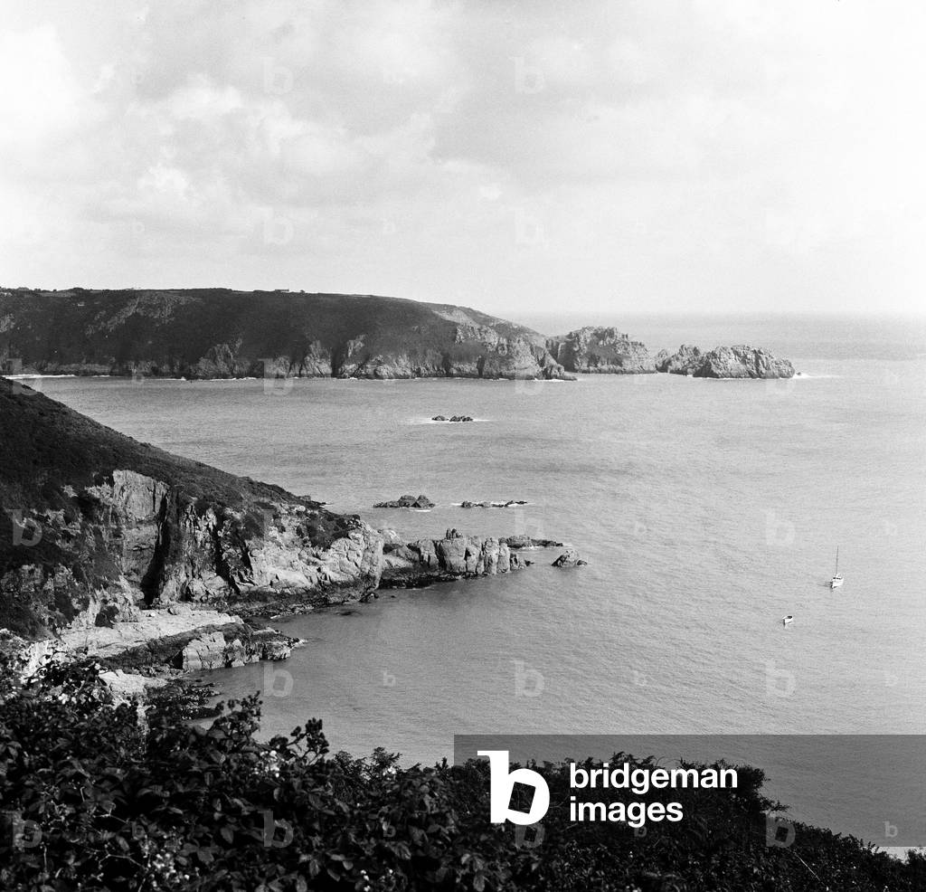 A view of Moulin Huet Bay and Jerbourg Point on the island of Guernsey, Channel Islands. September 1965 (b/w photo)