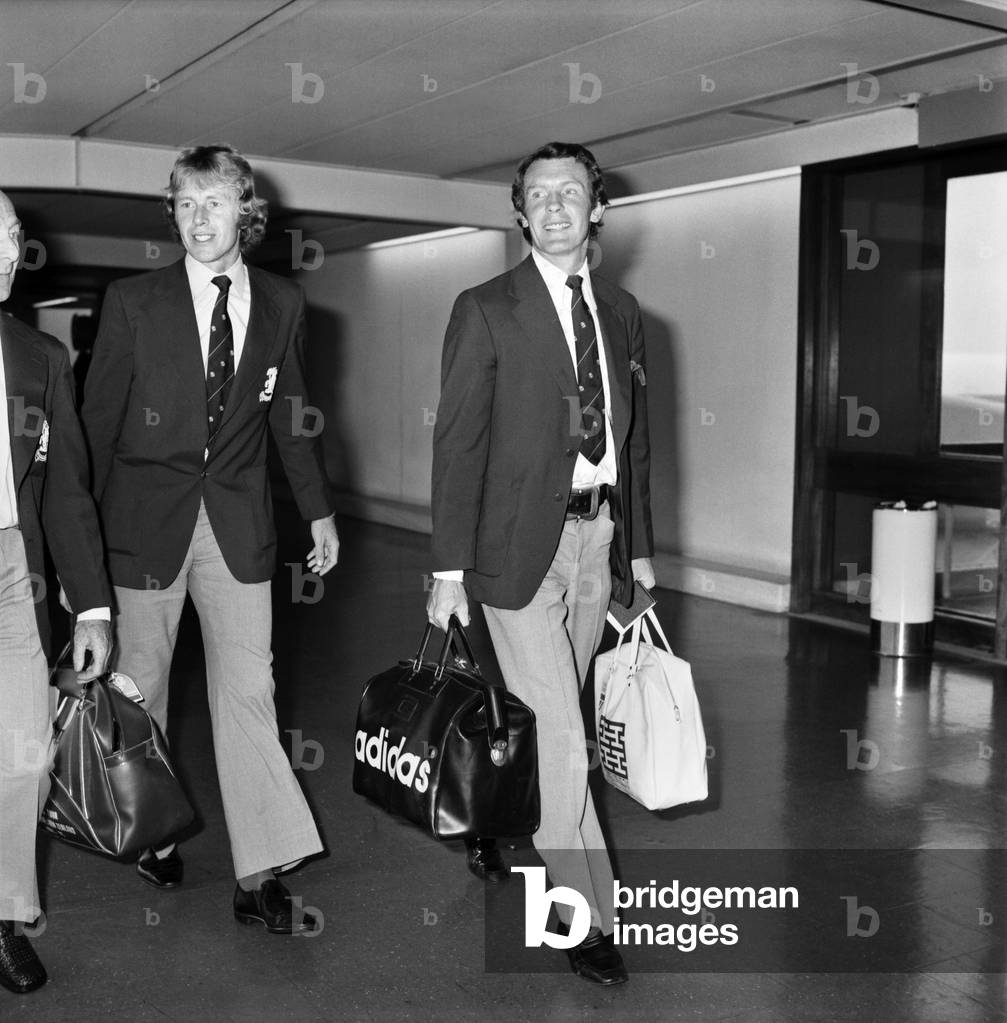 England Cricket: Mike Denness. MCC Cricket Team arrive home after their tour of Australia and New Zealand. Peter Lever and Mike Denness, March 1975 (b/w photo)