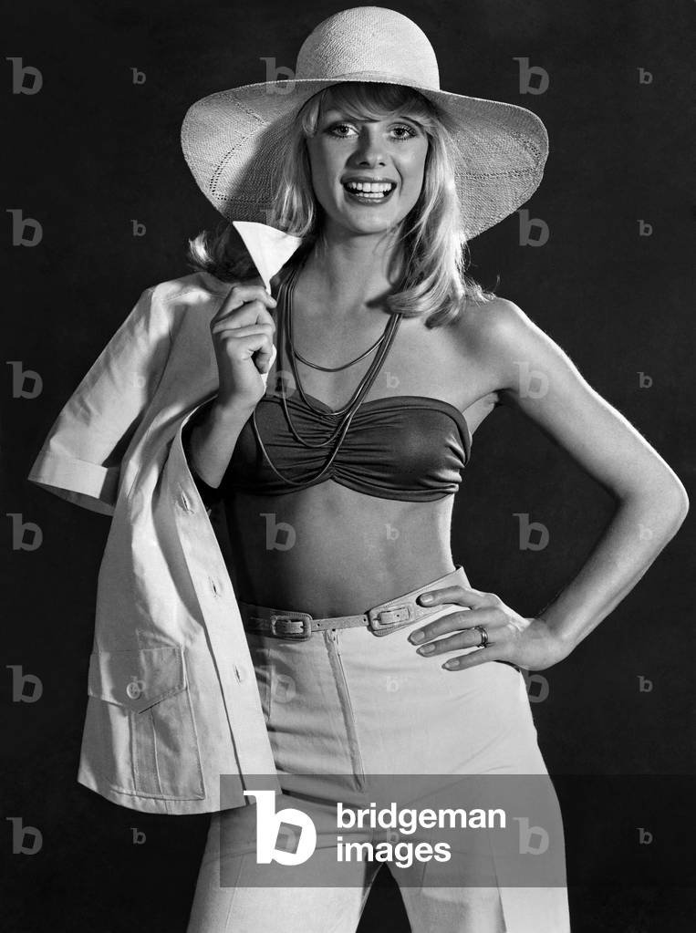 Clothing: Sharron Lynne. Buy a bandeau. It is the cheapest way to a sensational new fashion look. But do not keep it just for the beach. For a surprise effect wear it beneath a crisp tailored trouser suit and add a neckful of golden charms. Jersey bandeau top, £2.25, from Fenwicks, New Bond Street, London, W.1, available in many colours. Cotton salari jacket, £7.50, trousers, £4.95, by Trinitoy, sizes 10 to 14, in white, peach or yellow, from Way In, Harrods, Kightsbridge, London, S.W.1. Mail order is 25p extra. August 1973