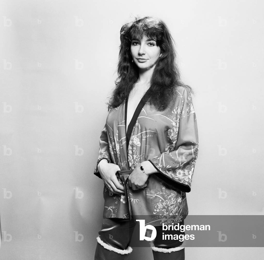 Pop singer Kate Bush poses in the studio wearing a kimono
March 1978