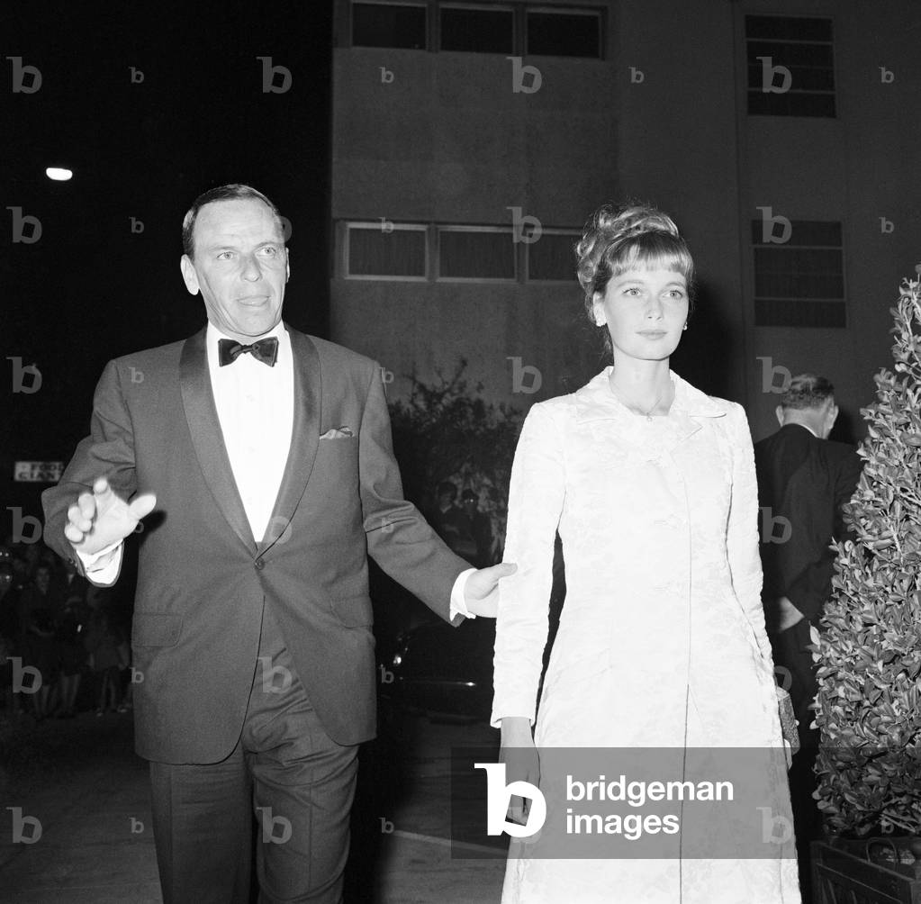 Frank Sinatra and Mia Farrow attend celebrity dinner party for guests of honour, Princess Margaret and the Earl of Snowdon, The Bistro Restaurant, Hollywood, California, USA, Monday 8th November 1965.