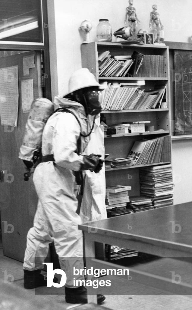 A firefighter checks the classroom is safe
