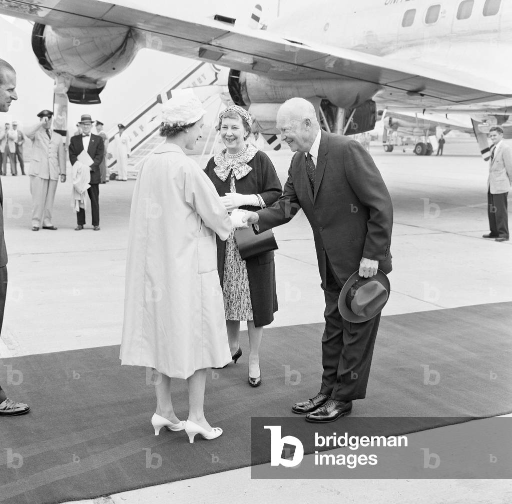 Queen Elizabeth welcomes President Eisenhower and his wife when they arrived by air form Wasington at the Royal Canadian Air Force base at St Hubert, near Montreal June 1959.