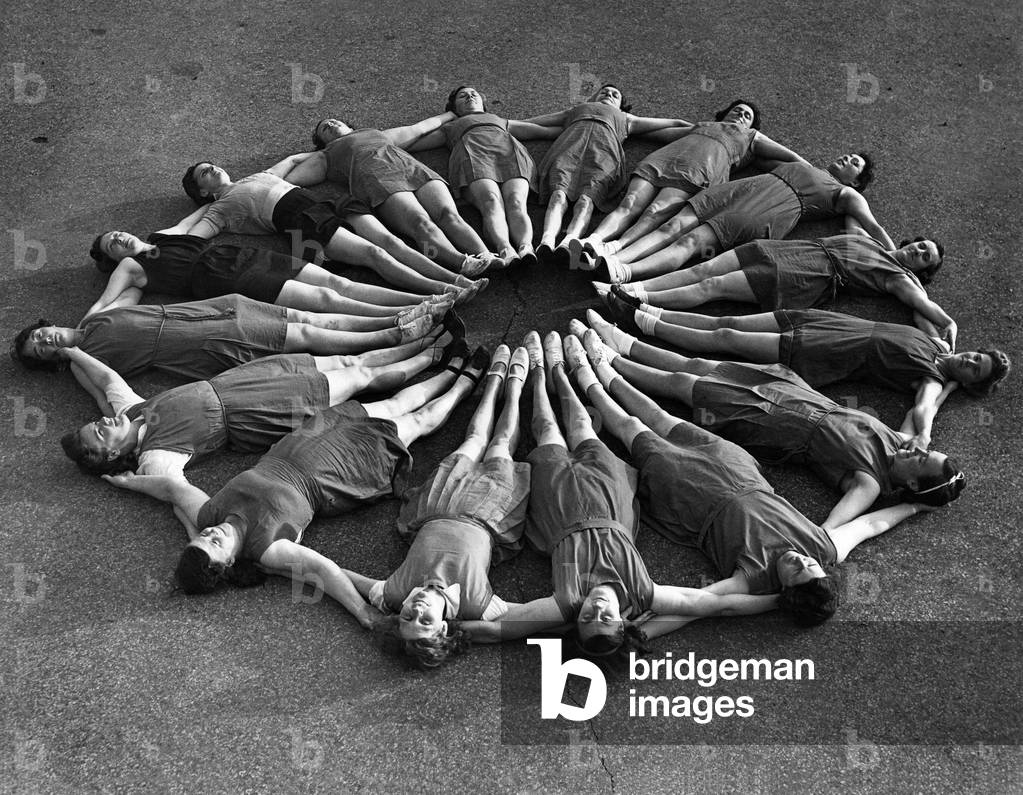 Mothers at the keep fit class held at the Churchdown Istitute Downham Estate for mothers. They are seen here forming a circle during one of the exercises. January 1944