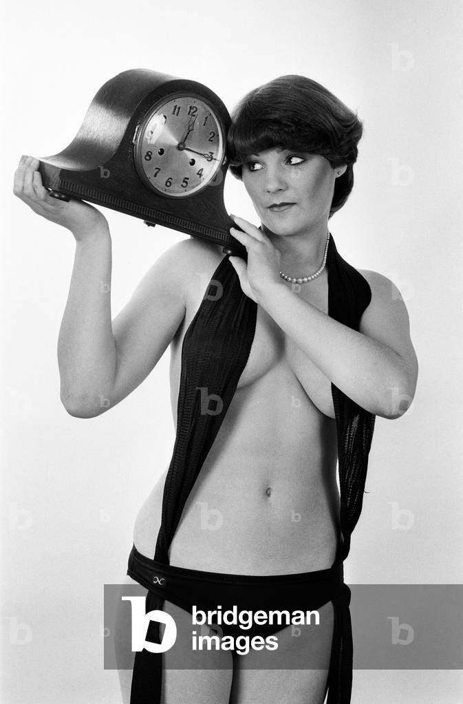 Model reminding people to put their clocks back by one hour at the end of British Summer Time. 25th October 1979 (b/w photo)