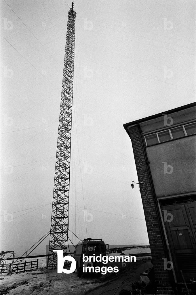 Rising out of the rubble of the TV mast that collapsed at Emley Moor, is a new 200 ft temporary mast. 23rd March 1969 (b/w photo)