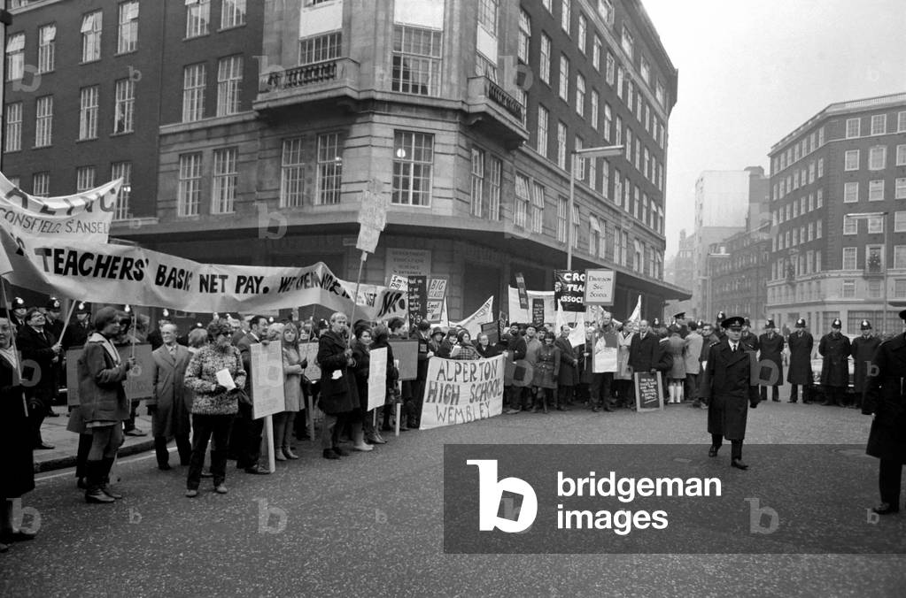 About 1,000 striking members of the National Union of teachers took part in a march from Regent's Park to the Department of Education and Science in Curzon Street today, where a deputation presented a resolution and petitions to the minister Mr. Edward Short. The end of the march at the Department of Education and Science in Curzon Street. December 1969