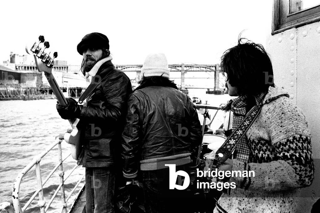 Lindisfarne sailed down the Tyne on a musical journey. The group were filming on board a Tyne ferry for a half-hour television show called 'All Right Now'. Rod Clements, Si Cowe and Ray Jackson pictured. 4th March, 1979 (b/w photo)