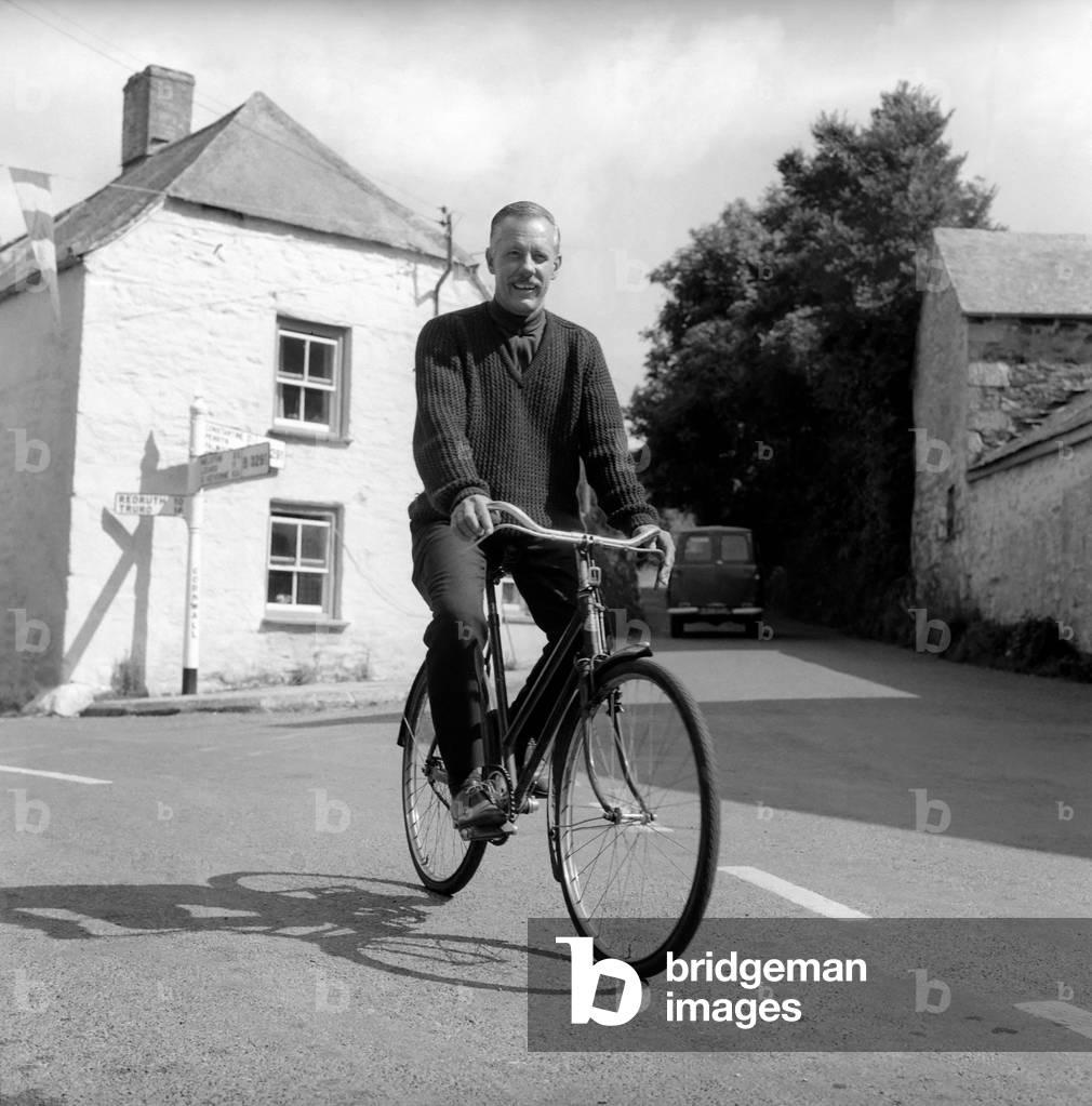 Man seen here riding his bike Circa 1968 (b/w photo)