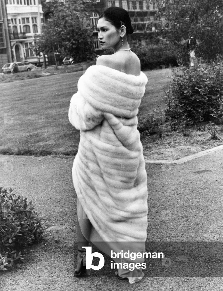 Model Julie wearing a ravishing decolte tulip shaped evening coat in white saga mink, designed by Kate McGuirk of Leigh-on-Sea