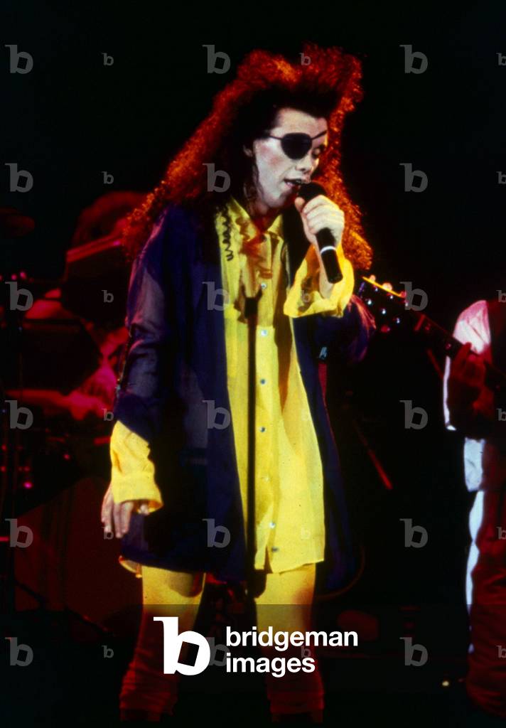 Singer Pete Burns from pop group Dead or Alive performing live on stage 
September 1985