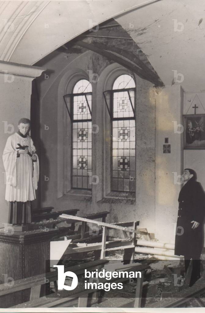 A Roman Catholic church damaged by enemy action during an air raid on the North East of England. 14th March 1943