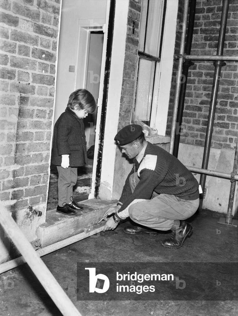 Mark Diment with Segt. McKeeman at the Chancellor Grove, childrens home, West Norwood,where the Marines are building his play area. November 1969