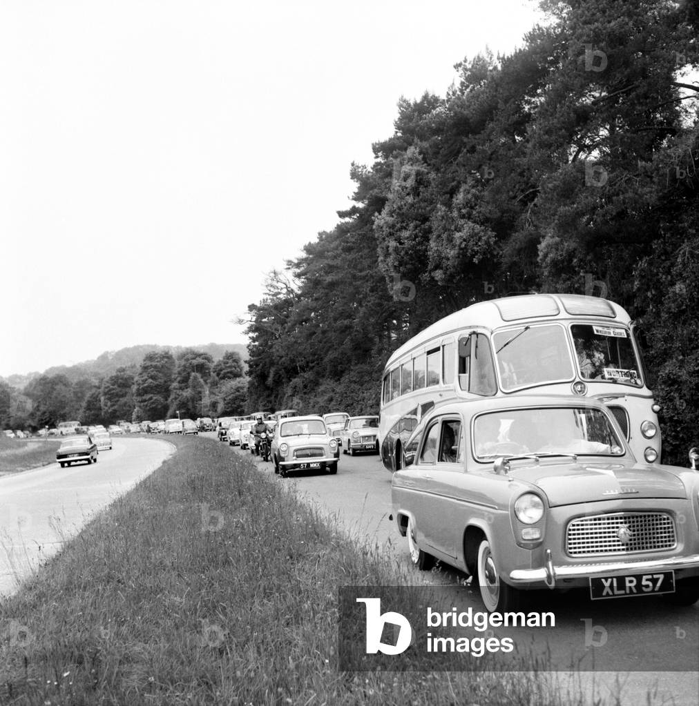 Traffic 1960. Homeward bound traffic on the Worthing-London road at Washington was slowed to a crawl where the road was narrowed to a single lane. June 1960 M4324-003