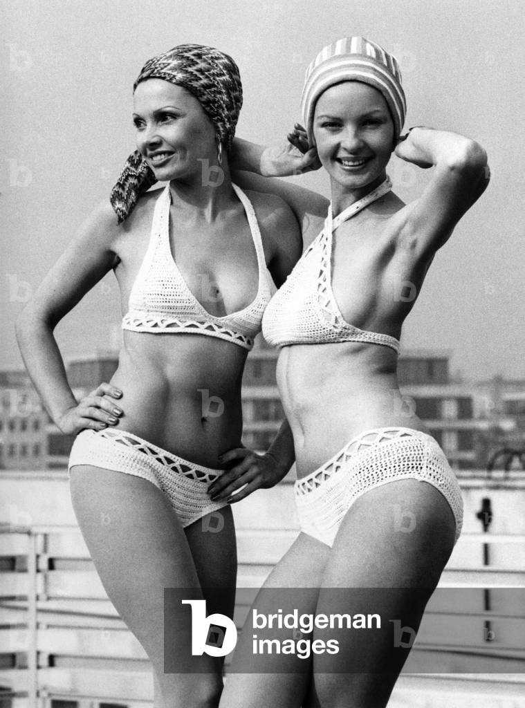 Two attractive caps by Jantzen. On the left Christa wears a stretch fabric swimturban. Michele's swim cloche is inspired by the trendy headgear worn by Ali McGraw in the film 