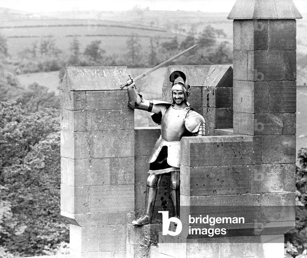 John Mordan tried being a Knight for a day at Langley Castle, but found it hard to take an aggressive stance wearing 30 lbs. of steel armour in June 1972 (b/w photo)