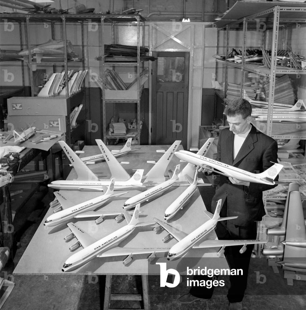 Factory where model aircraft for the travel agents are made. Men making model planes. Circa 1960