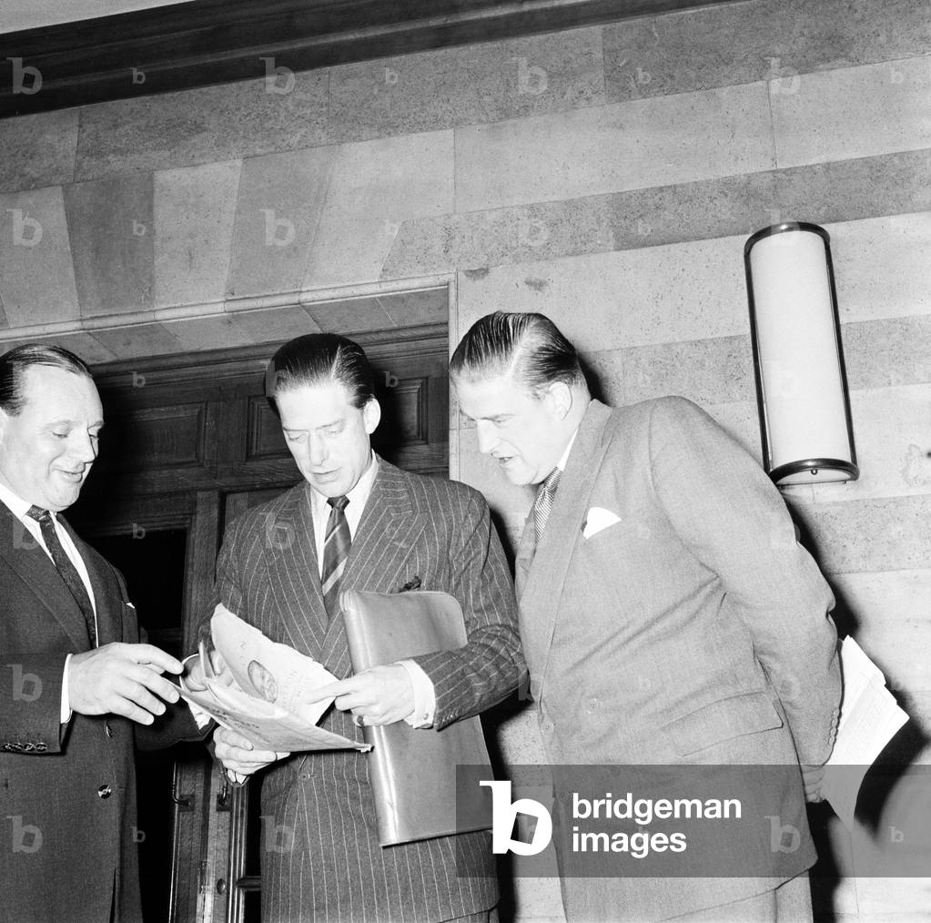 George Henry Hubert Lascelles discusses arrangements for jazz section of Leeds Music Festival 1958 with his brother Gerald Lascelles and John Addleston 1958 (b/w photo)