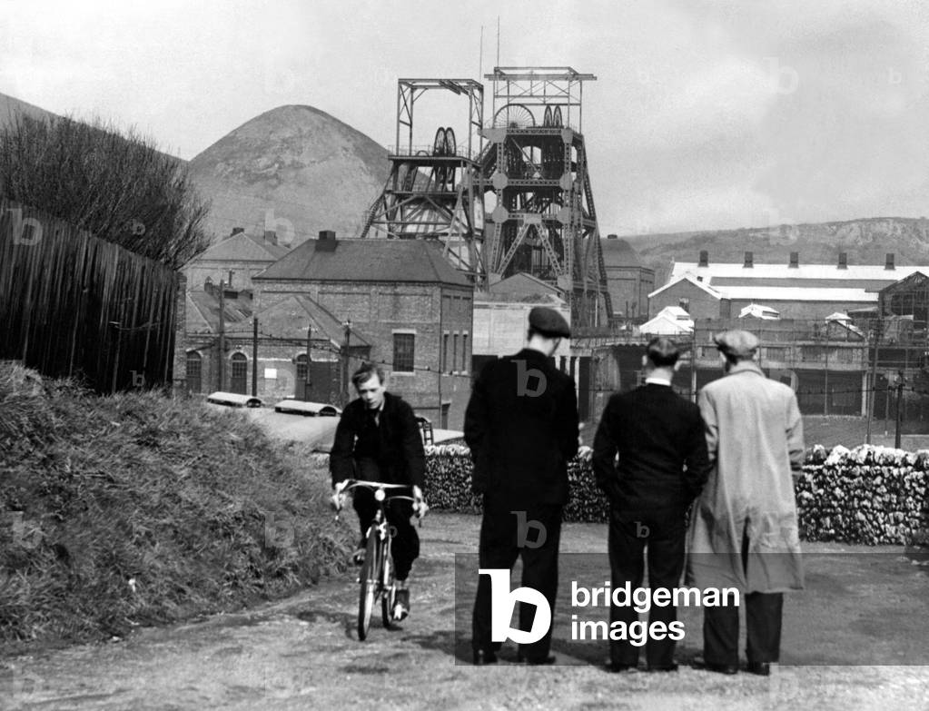 The National Miners Strike 1947 Miners at Ryhope, who have decided that striking winders must not be allowed to resume work at the pit, watch the idle pithead 6 May 1947 (b/w photo)