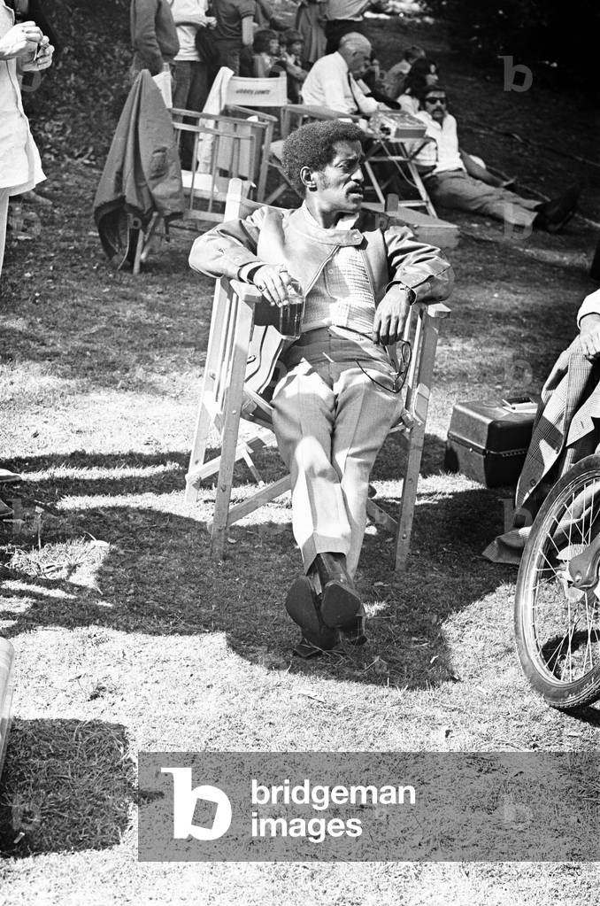 Sammy Davis Junior takes a break from filming at Eastnor Castle Ledbury, for 