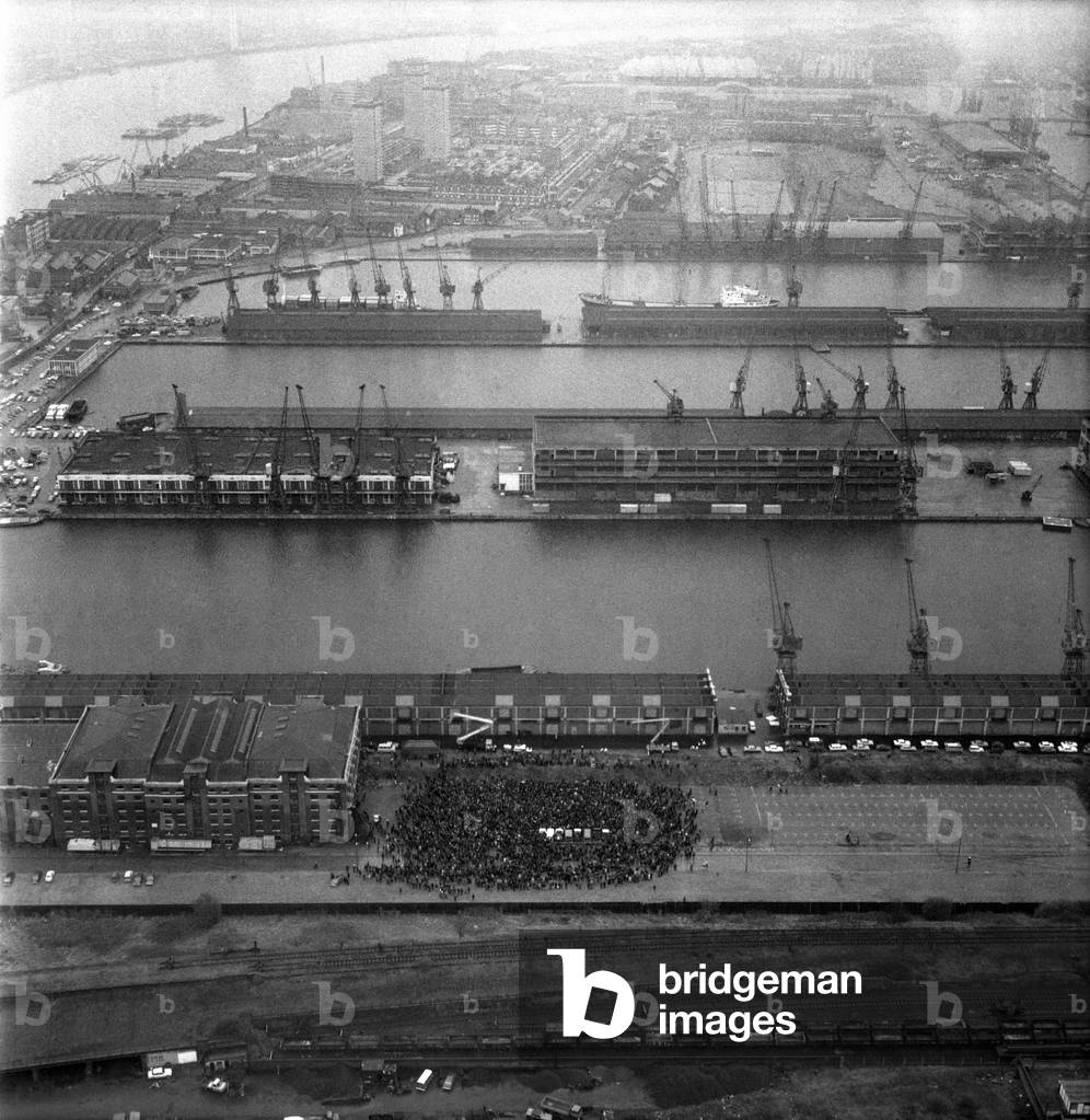 Aerial views of London Docks as dockers vote to end their five week strike which had crippled the docks, April 1975 (b/w photo)